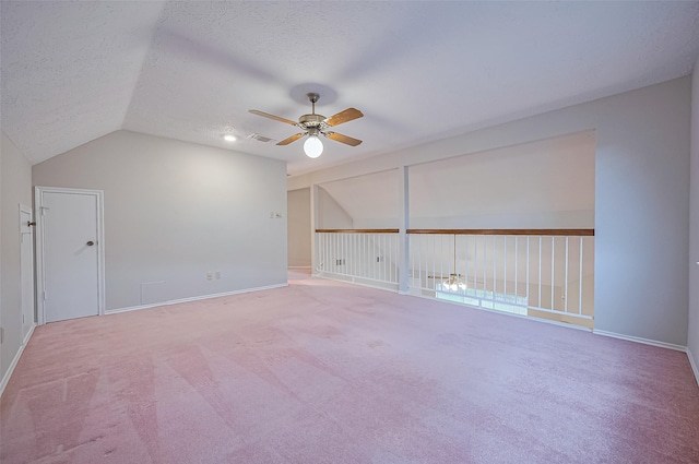2415 Pebbledowne Cir, Sugar Land, TX 77478 - additional living space featuring ceiling fan, lofted ceiling, a textured ceiling, and carpet flooring