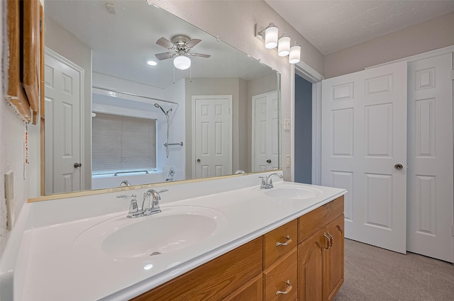 2415 Pebbledowne Cir, Sugar Land, TX 77478 - full bath with double vanity,  shower combination, and ceiling fan