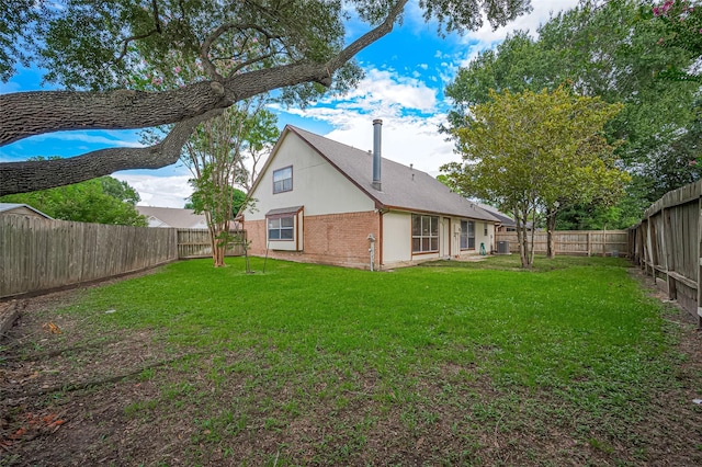 2415 Pebbledowne Cir, Sugar Land, TX 77478 - rear view of house featuring a fenced backyard and brick siding