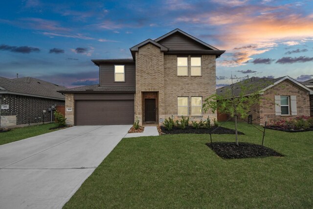 4985 Blue Beetle Ridge Dr, Katy, TX 77493 - traditional-style home featuring driveway, a front lawn, and brick siding