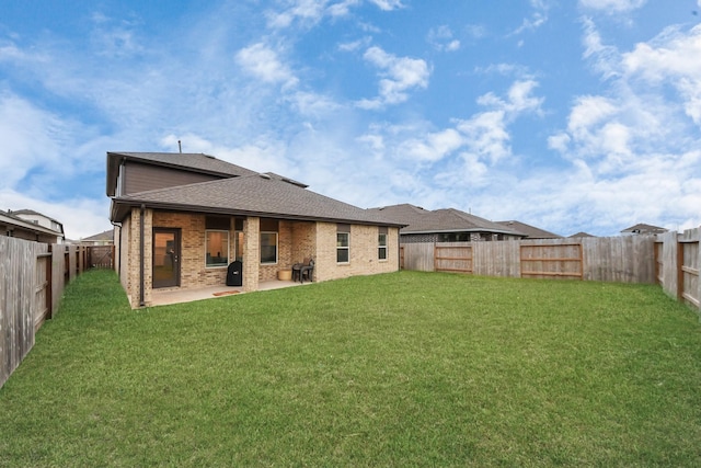 4985 Blue Beetle Ridge Dr, Katy, TX 77493 - back of house with a patio, a fenced backyard, brick siding, and roof with shingles