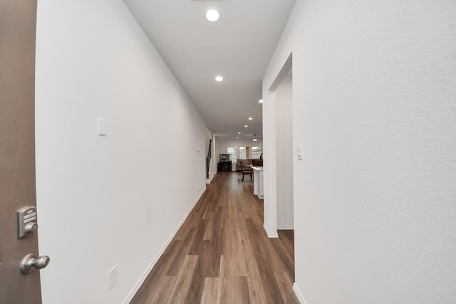 4985 Blue Beetle Ridge Dr, Katy, TX 77493 - corridor with recessed lighting and wood finished floors