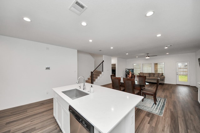 4985 Blue Beetle Ridge Dr, Katy, TX 77493 - kitchen featuring dishwasher, recessed lighting, dark wood-style floors, a center island with sink, and white cabinets