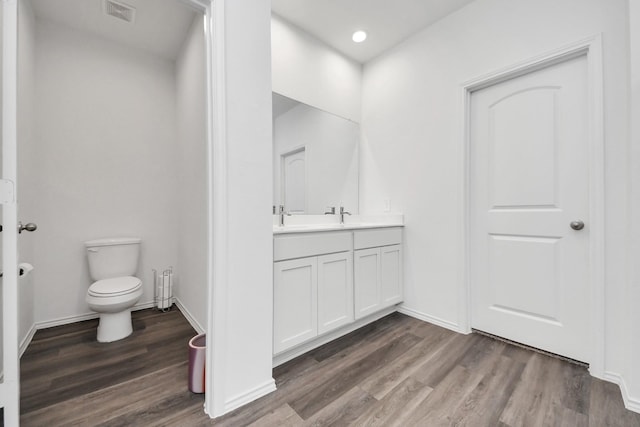 4985 Blue Beetle Ridge Dr, Katy, TX 77493 - full bathroom with wood finished floors, double vanity, and recessed lighting