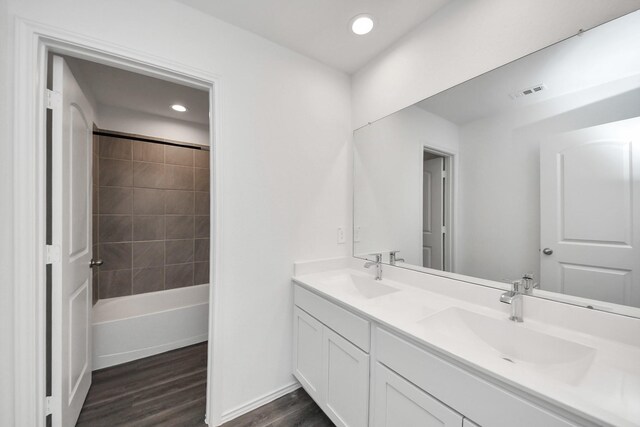 4985 Blue Beetle Ridge Dr, Katy, TX 77493 - full bath featuring wood finished floors, double vanity, and recessed lighting