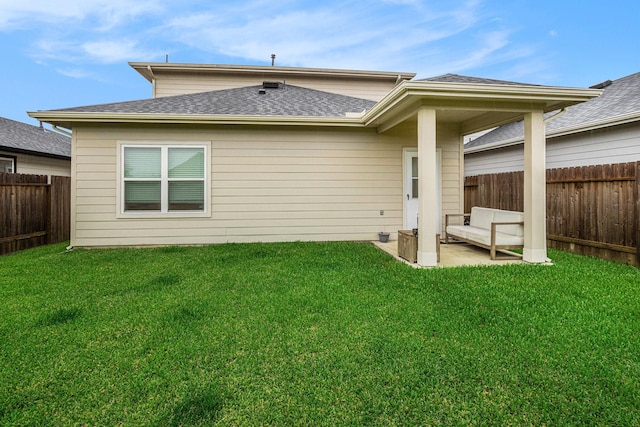 12810 Barnesbury Ln, Houston, TX 77047 - rear view of house with a fenced backyard, roof with shingles, and a patio