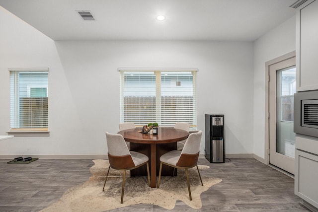 12810 Barnesbury Ln, Houston, TX 77047 - dining space with healthy amount of natural light, wood finished floors, and recessed lighting