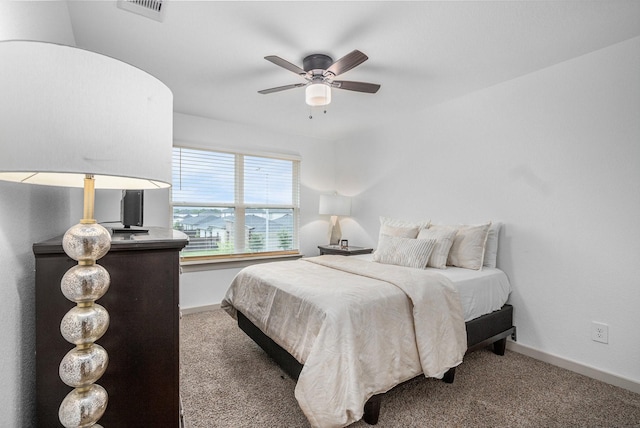 12810 Barnesbury Ln, Houston, TX 77047 - carpeted bedroom featuring baseboards and a ceiling fan
