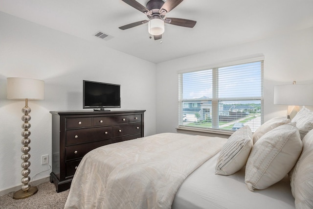 12810 Barnesbury Ln, Houston, TX 77047 - carpeted bedroom with baseboards and ceiling fan