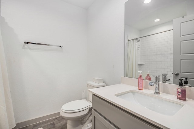 12810 Barnesbury Ln, Houston, TX 77047 - bathroom featuring vanity, wood finished floors, a shower with curtain, and recessed lighting