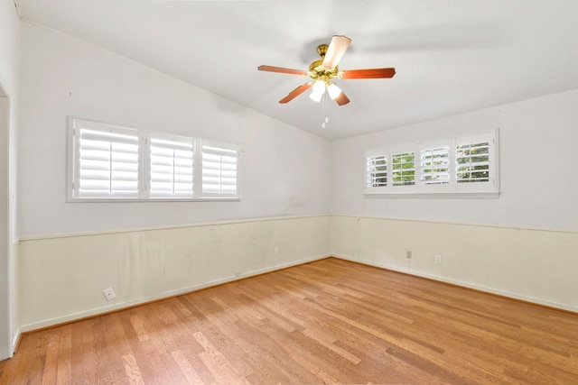 1202 Fay Rd, Kemah, TX 77565 - spare room featuring wood finished floors, lofted ceiling, and a ceiling fan