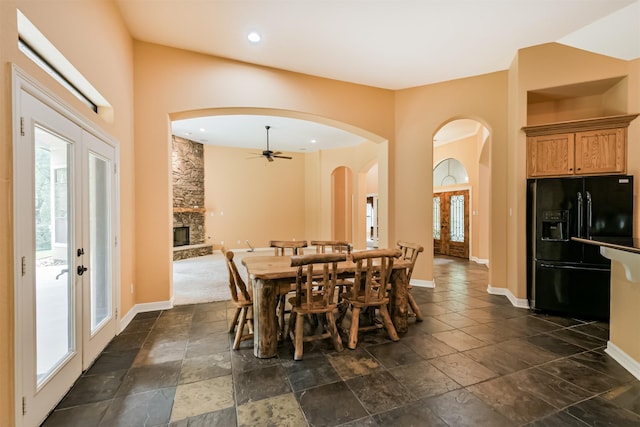 26150 Crown Ranch Blvd, Montgomery, TX 77316 - dining area featuring plenty of natural light, french doors, a ceiling fan, arched walkways, and recessed lighting