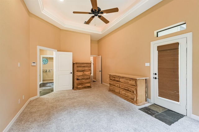 26150 Crown Ranch Blvd, Montgomery, TX 77316 - carpeted entrance foyer featuring ceiling fan, a tray ceiling, and crown molding