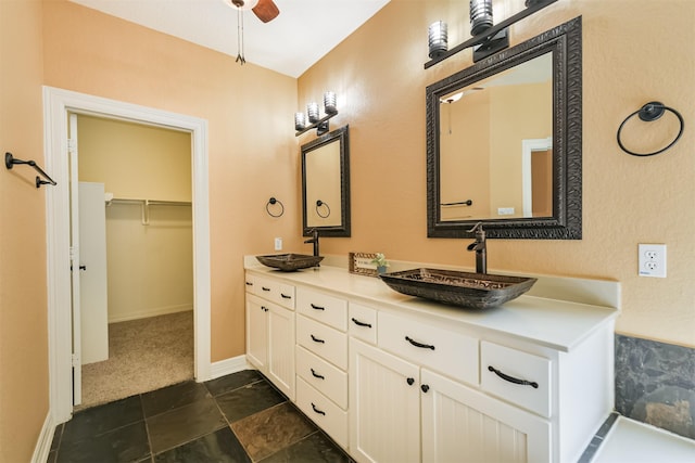 26150 Crown Ranch Blvd, Montgomery, TX 77316 - full bath with double vanity, a ceiling fan, and a spacious closet