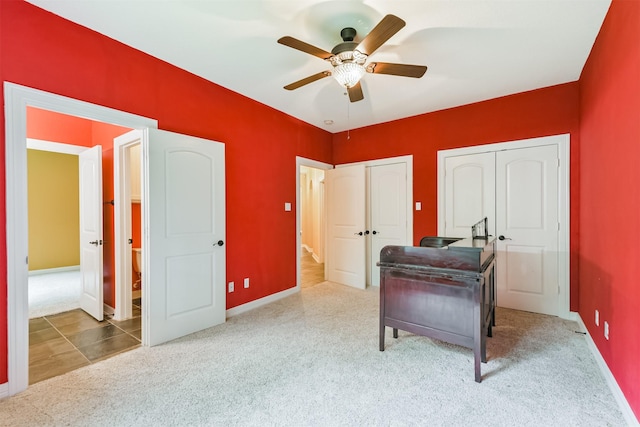 26150 Crown Ranch Blvd, Montgomery, TX 77316 - bedroom with carpet floors, multiple closets, and a ceiling fan