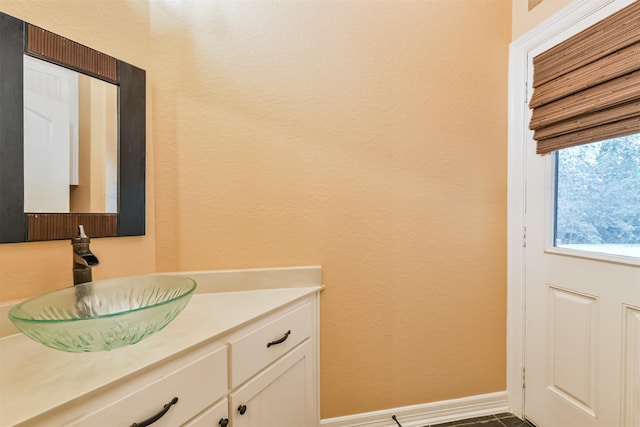 26150 Crown Ranch Blvd, Montgomery, TX 77316 - bathroom with vanity and a textured wall