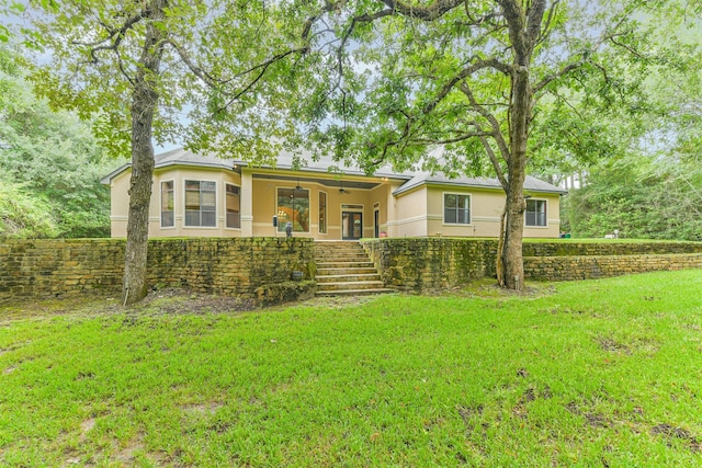 26150 Crown Ranch Blvd, Montgomery, TX 77316 - ranch-style home with stairs, stucco siding, ceiling fan, and a front yard