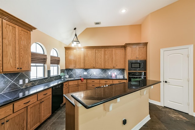 26150 Crown Ranch Blvd, Montgomery, TX 77316 - kitchen with black appliances, dark countertops, vaulted ceiling, a center island, and a breakfast bar area