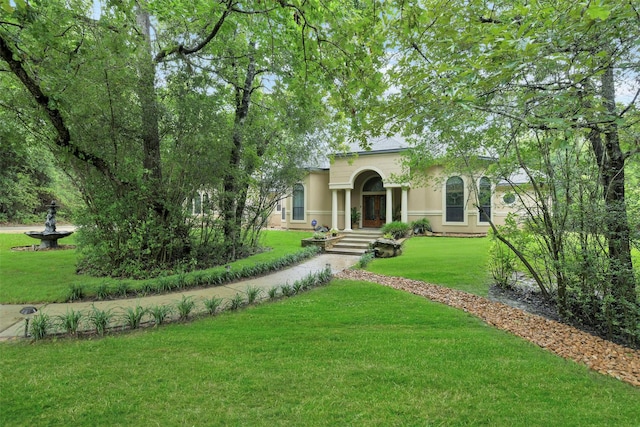 26150 Crown Ranch Blvd, Montgomery, TX 77316 - view of front facade featuring stucco siding and a front lawn