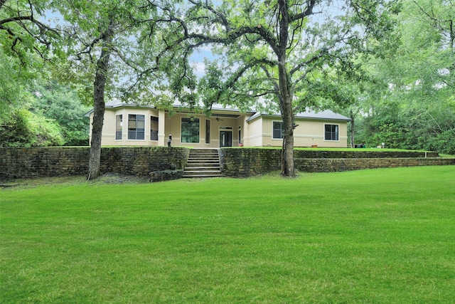 26150 Crown Ranch Blvd, Montgomery, TX 77316 - view of front of home with stairs, stucco siding, and a front yard