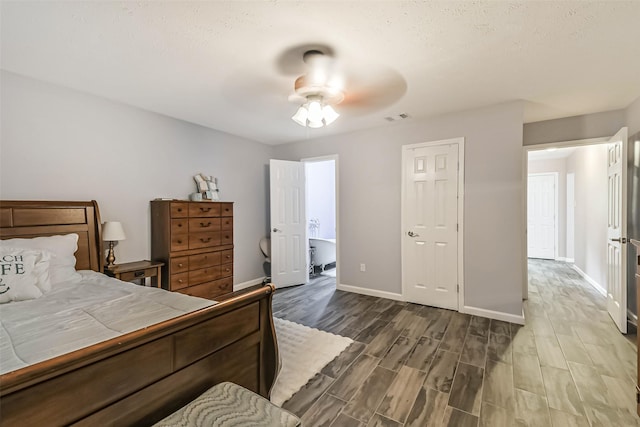 637 Mosswood Dr, Conroe, TX 77302 - bedroom with dark wood finished floors and ceiling fan