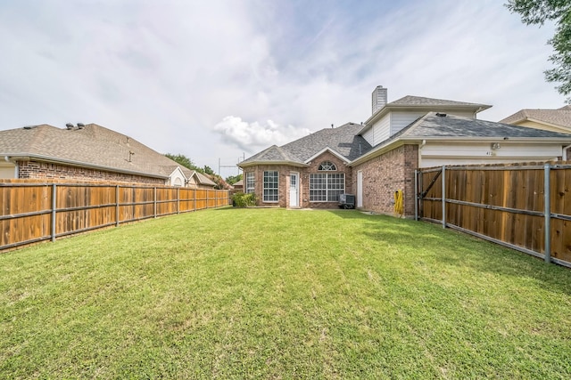 412 Belmont Ct, Lewisville, TX 75067 - back of property featuring brick siding, a chimney, a fenced backyard, and roof with shingles