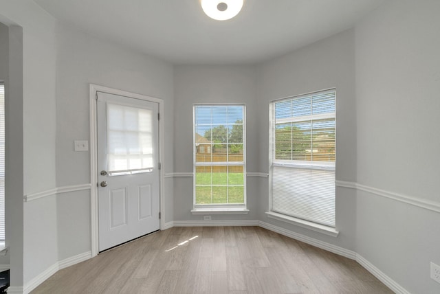412 Belmont Ct, Lewisville, TX 75067 - entryway with light wood-style flooring and baseboards