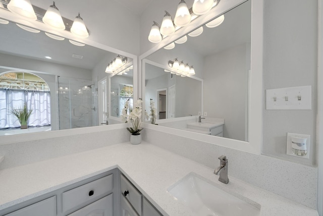 412 Belmont Ct, Lewisville, TX 75067 - bathroom with a stall shower, vanity, and a chandelier