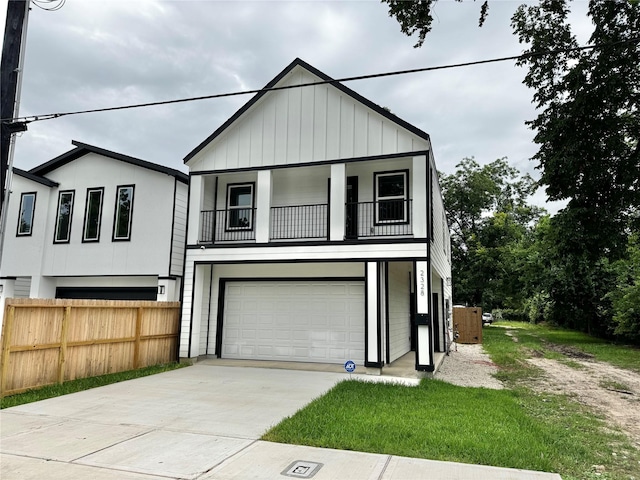 2328 Wavell St, Houston, TX 77088 - view of front of house with a balcony, an attached garage, and driveway