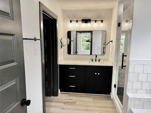 2328 Wavell St, Houston, TX 77088 - bathroom with a shower stall, vanity, and wood finished floors