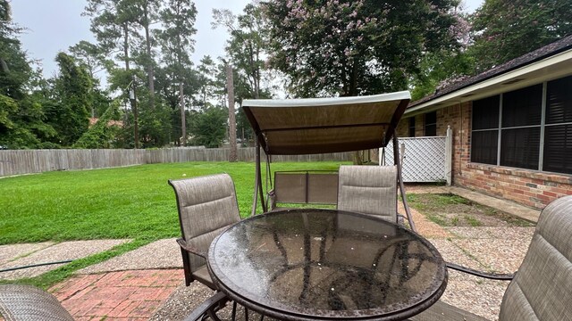 2514 Creekleaf Rd, Houston, TX 77068 - fenced backyard with outdoor dining space and a patio