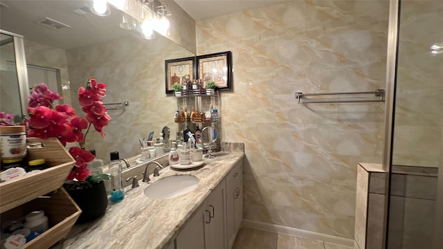 2514 Creekleaf Rd, Houston, TX 77068 - bathroom featuring double vanity, tile patterned floors, and tile walls