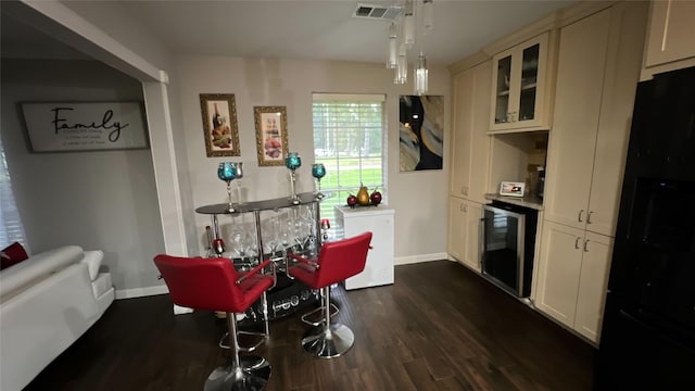 2514 Creekleaf Rd, Houston, TX 77068 - dining space with beverage cooler and dark wood finished floors