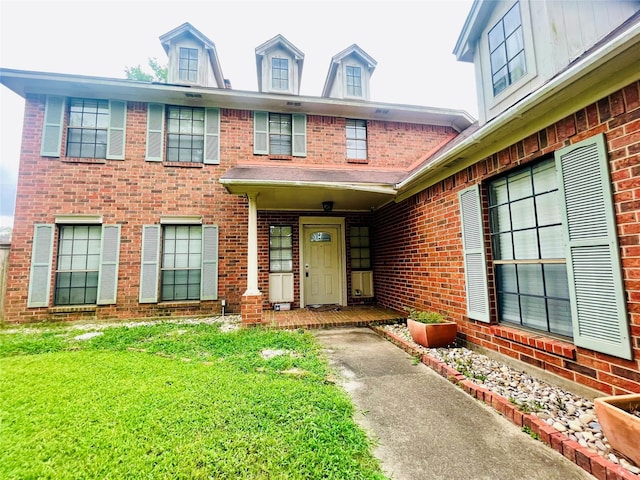55 Sweetleaf Ct, Lake Jackson, TX 77566 - view of front of property with brick siding and a front lawn
