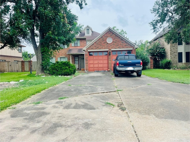 55 Sweetleaf Ct, Lake Jackson, TX 77566 - view of front of house with brick siding, an attached garage, and driveway