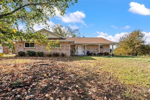 446 Norwood St, Marlin, TX 76661 - ranch-style home with a front lawn and brick siding