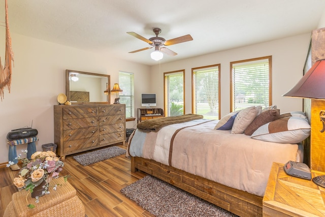 1211 Tall Pines Dr, Friendswood, TX 77546 - bedroom with wood finished floors and ceiling fan