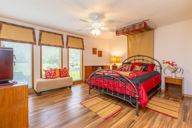 1211 Tall Pines Dr, Friendswood, TX 77546 - bedroom featuring wood finished floors and ceiling fan