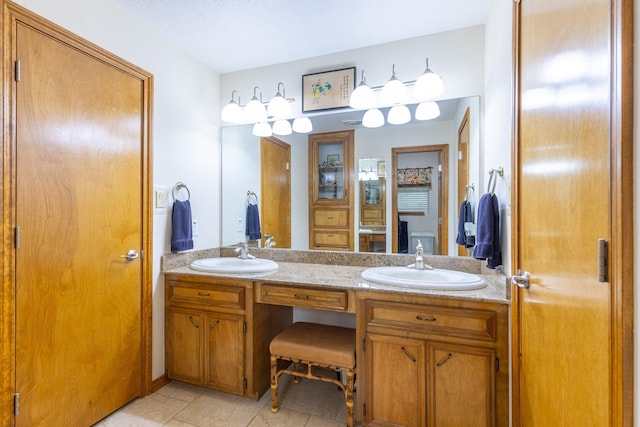 1211 Tall Pines Dr, Friendswood, TX 77546 - bathroom with double vanity and tile patterned flooring