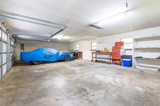 1211 Tall Pines Dr, Friendswood, TX 77546 - garage with a garage door opener and electric panel