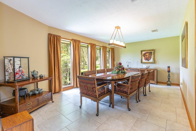 1211 Tall Pines Dr, Friendswood, TX 77546 - dining space with baseboards