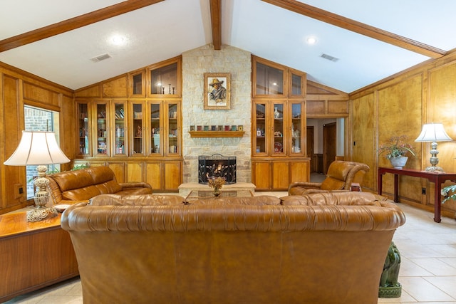 1211 Tall Pines Dr, Friendswood, TX 77546 - living area featuring light tile patterned flooring, wood walls, a stone fireplace, beam ceiling, and high vaulted ceiling