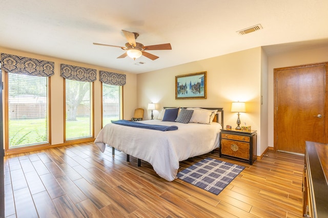 1211 Tall Pines Dr, Friendswood, TX 77546 - bedroom featuring light wood-style floors and ceiling fan