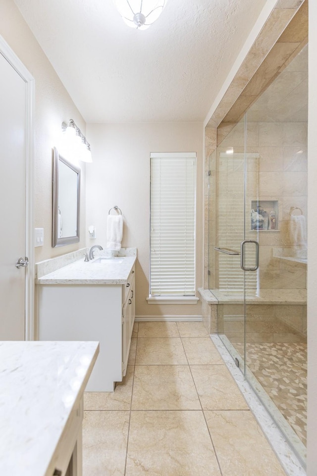 1211 Tall Pines Dr, Friendswood, TX 77546 - bathroom featuring vanity, a stall shower, and tile patterned floors