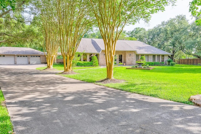 1211 Tall Pines Dr, Friendswood, TX 77546 - single story home featuring driveway and a detached garage