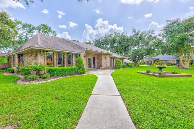 1211 Tall Pines Dr, Friendswood, TX 77546 - ranch-style home featuring brick siding, a front lawn, and a shingled roof