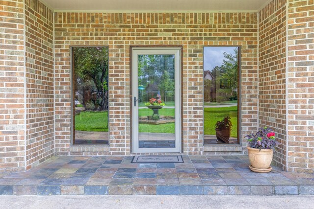 1211 Tall Pines Dr, Friendswood, TX 77546 - doorway to property featuring brick siding
