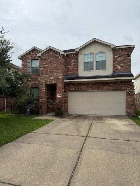 20019 Linden Spruce Ln, Richmond, TX 77407 - traditional-style home featuring brick siding, concrete driveway, a garage, and a front yard