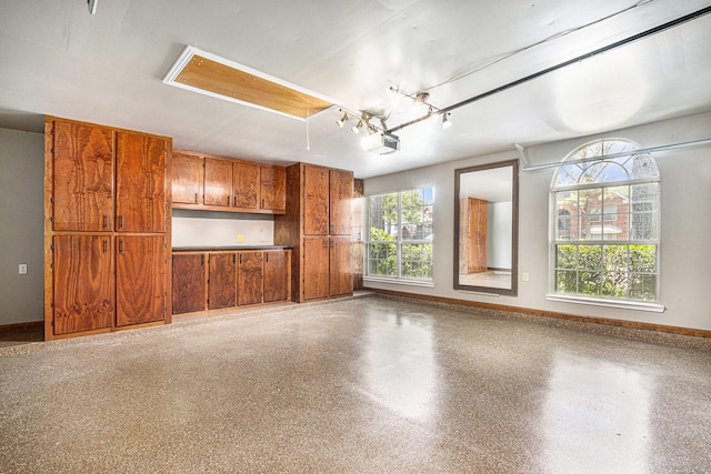3311 Baden Oaks Ct, Katy, TX 77494 - garage featuring a garage door opener and baseboards
