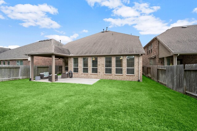 29522 Westhope Dr, Spring, TX 77386 - rear view of house with a patio, brick siding, a fenced backyard, and roof with shingles